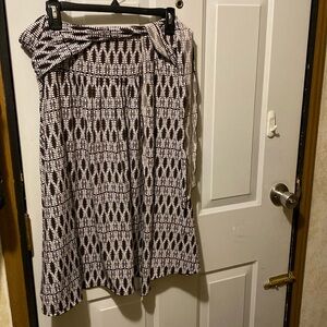 It’s a skirt with brown and white pattern and a belt attached